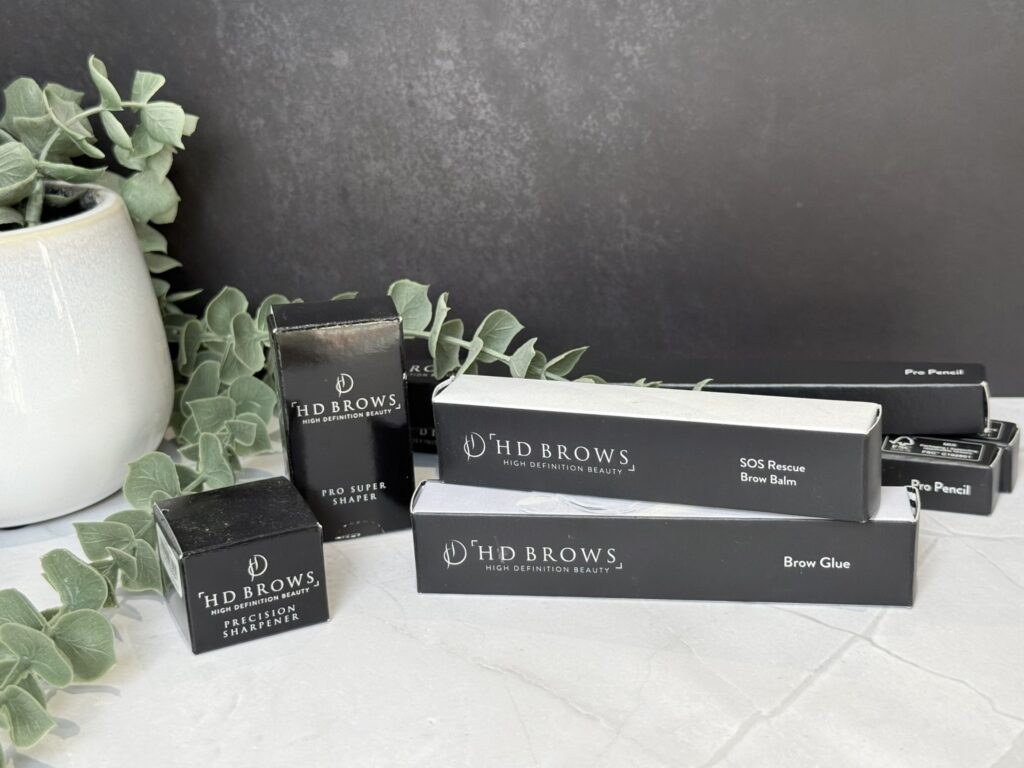 HD Brows products with a dark background